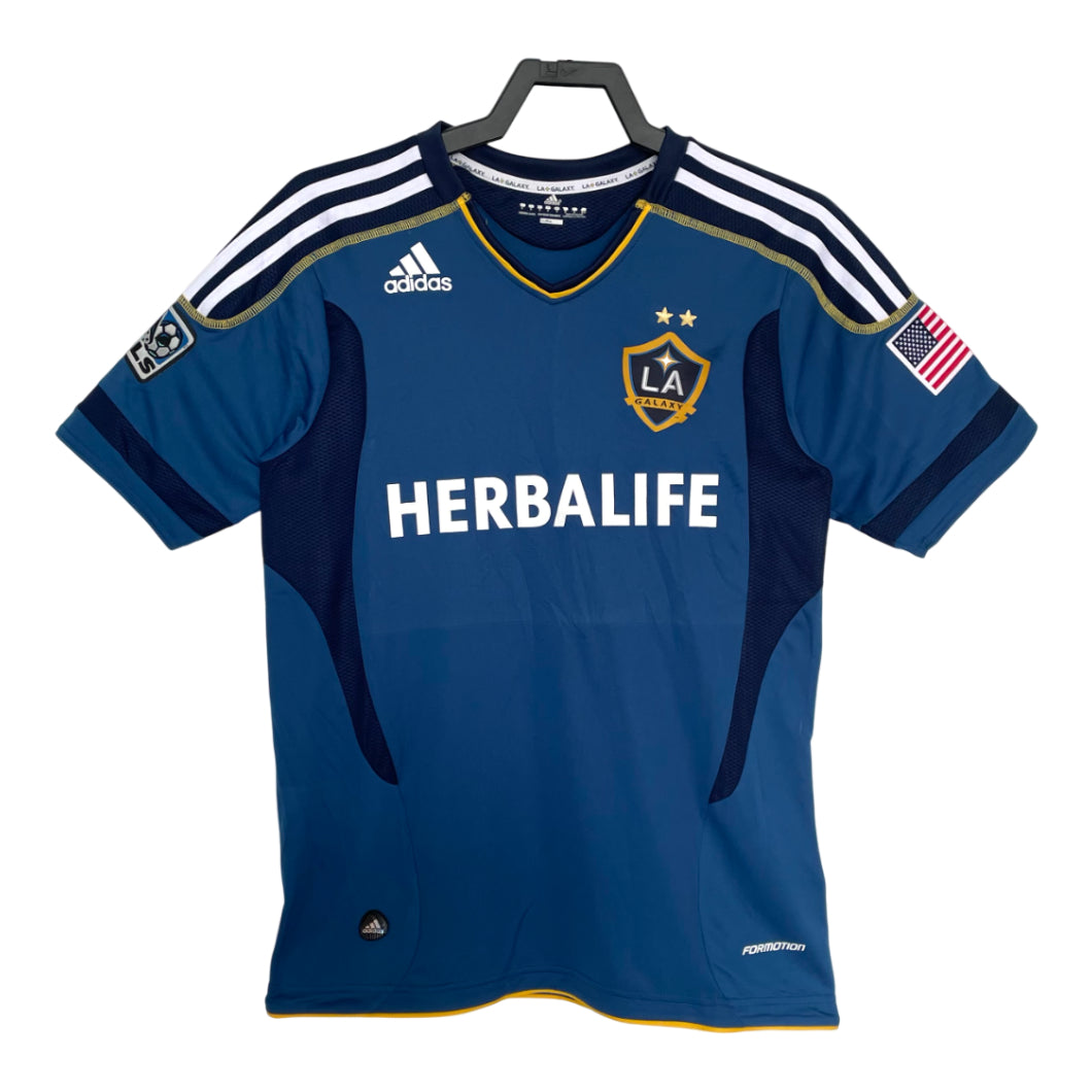 Blue sports jersey with Adidas and Herbalife logos on a white background