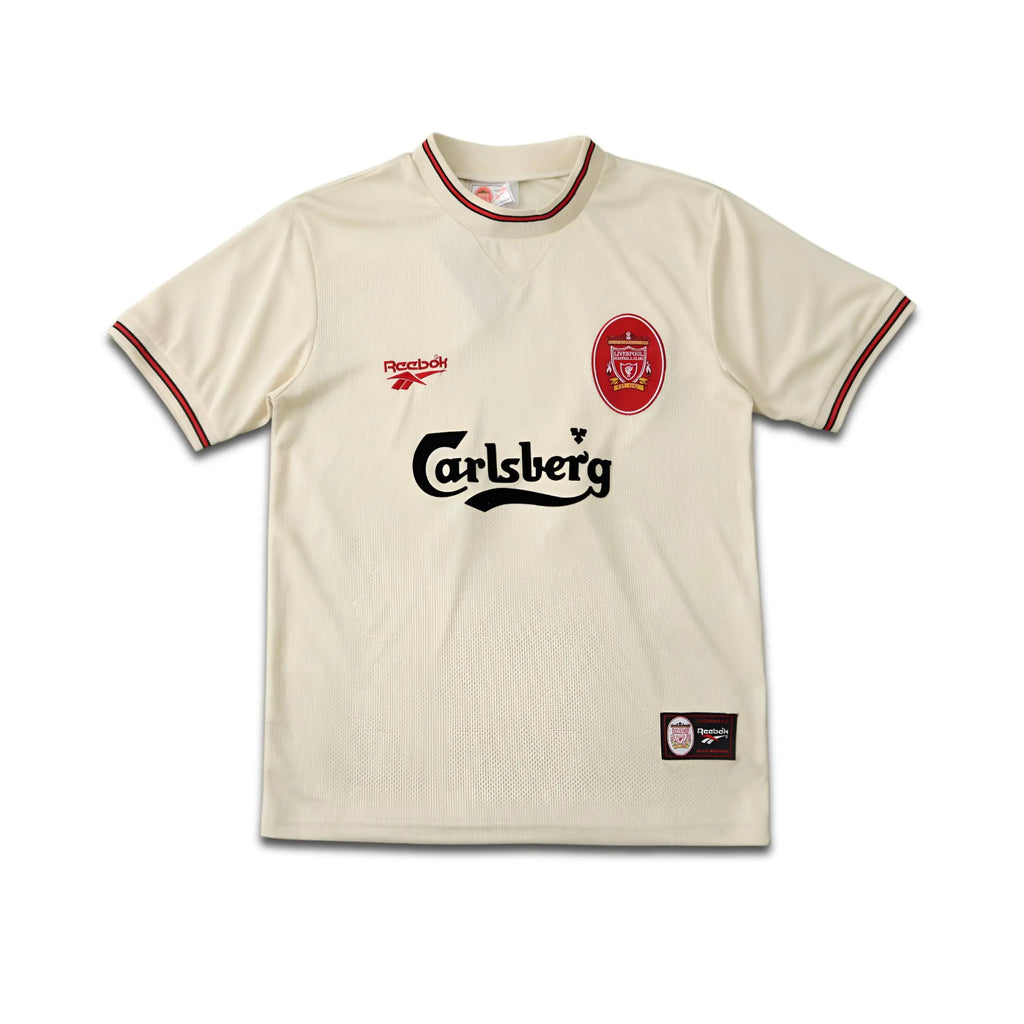 Beige Liverpool FC jersey with Reebok and Carlsberg logos on a white background