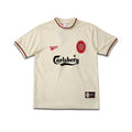 Beige Liverpool FC jersey with Reebok and Carlsberg logos on a white background