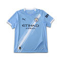 Light blue Manchester City sports jersey with branding on a white background