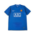Blue Man United jersey with Nike logo and AIG branding on a white background