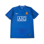 Blue Man United jersey with Nike logo and AIG branding on a white background