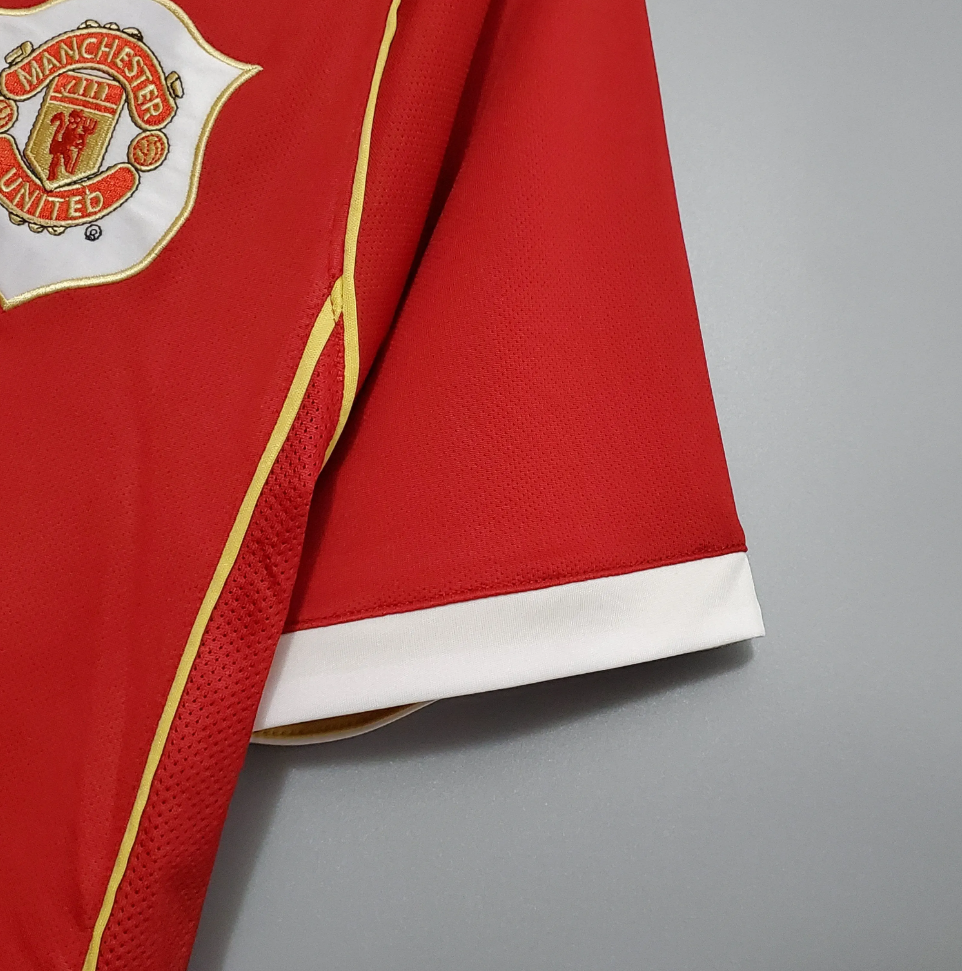 Manchester United retro AIG shirt from the 2006/07 season where legends of the game like Cristiano Ronaldo, displayed his excellence in Manchester Red.