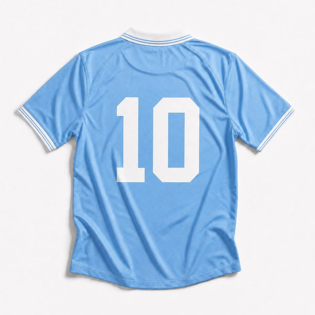 A light blue short-sleeve soccer jersey shown from the back, featuring the number 10 in large white block letters and white trim on the collar and sleeve cuffs, set against a clean white background.