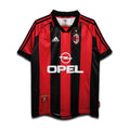 Red and black sports jersey with Opel and Adidas logos on a white background