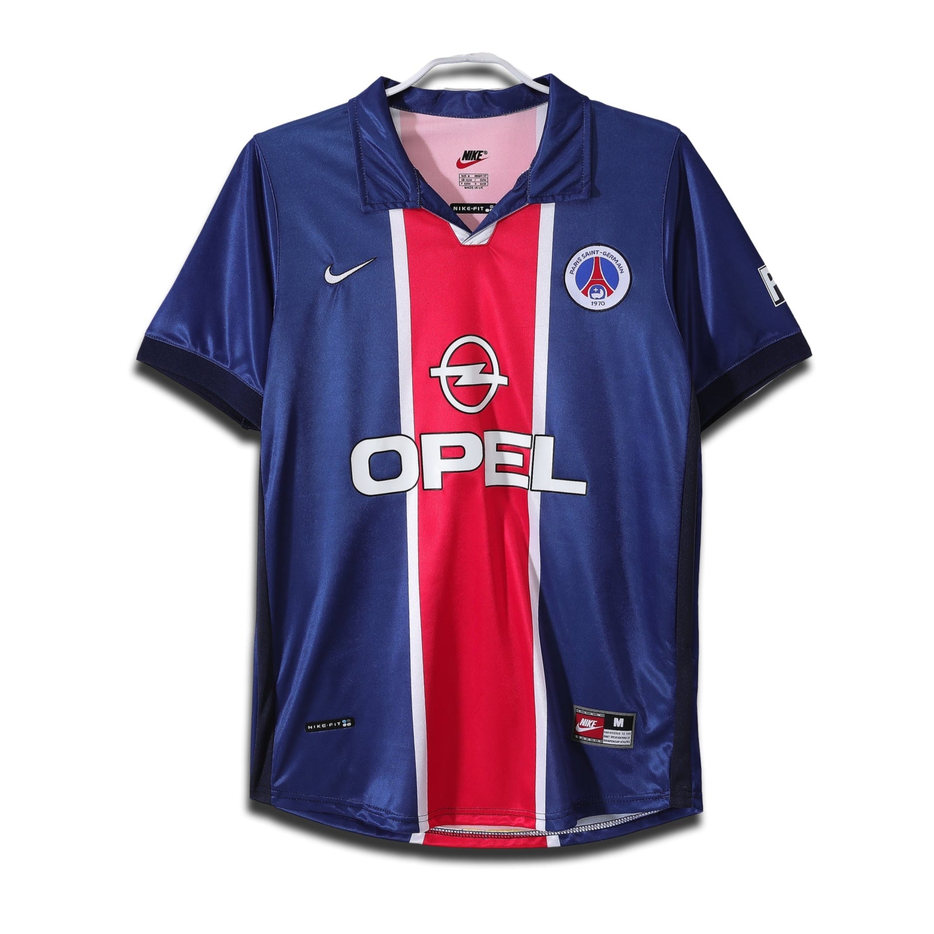 A classic Paris Saint-Germain home shirt featuring a red central stripe on a blue background, with white trim and Opel sponsor branding.