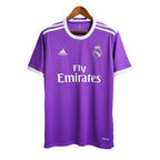Purple sports jersey with Adidas and Real Madrid logos on a hanger