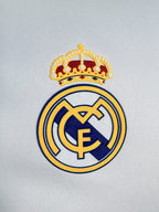 Real Madrid logo on a light gray background