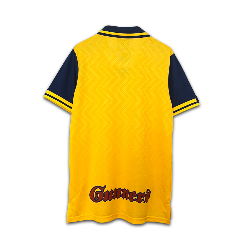 Yellow and navy sports jersey with 'Gunners' branding on a white background