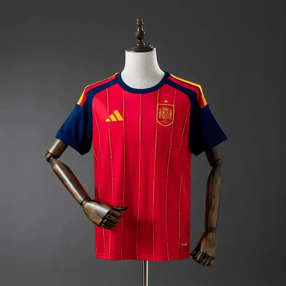 Red sports jersey with blue sleeves on a mannequin against a gray background
