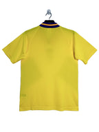 Yellow Sweden soccer shirt on a hanger against a white background