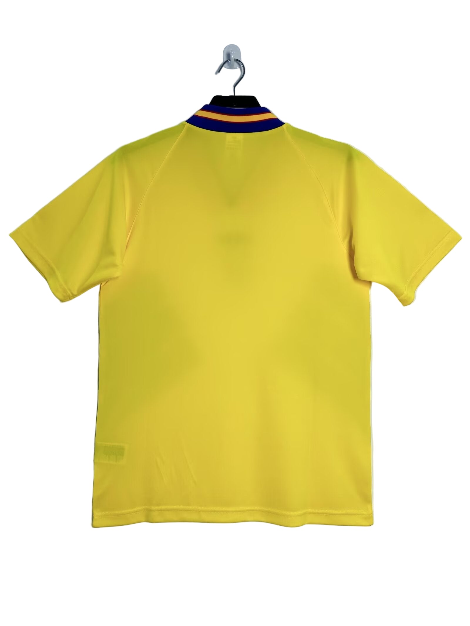 Yellow Sweden soccer shirt on a hanger against a white background