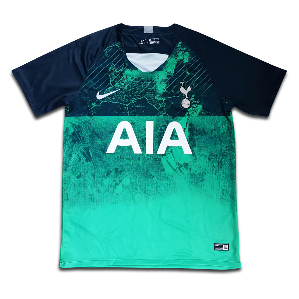 Green and navy sports jersey with 'AIA' and 'Tottenham' branding on a white background