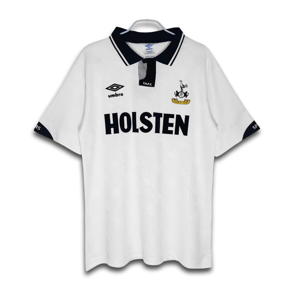 A white Tottenham Hotspur home shirt from the 1991/93 season with the Holsten sponsor logo and Hummel chevrons.