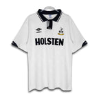 A white Tottenham Hotspur home shirt from the 1991/93 season with the Holsten sponsor logo and Hummel chevrons.