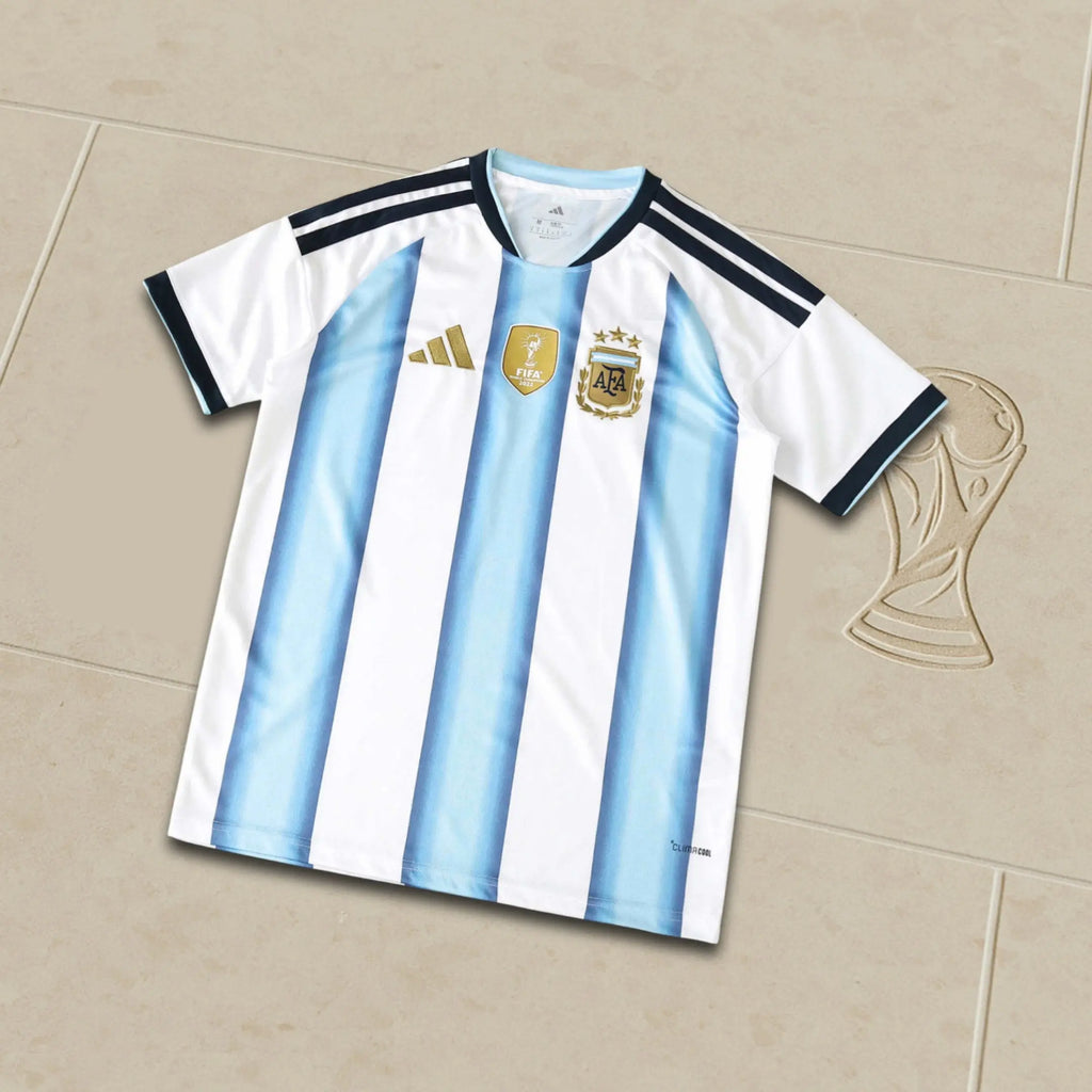 Argentina soccer jersey with Adidas logo on a beige background