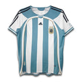 Argentina national football team home shirt from the 2006 FIFA World Cup, featuring sky blue and white vertical stripes with black accents, Adidas logo, and the Argentine national emblem.