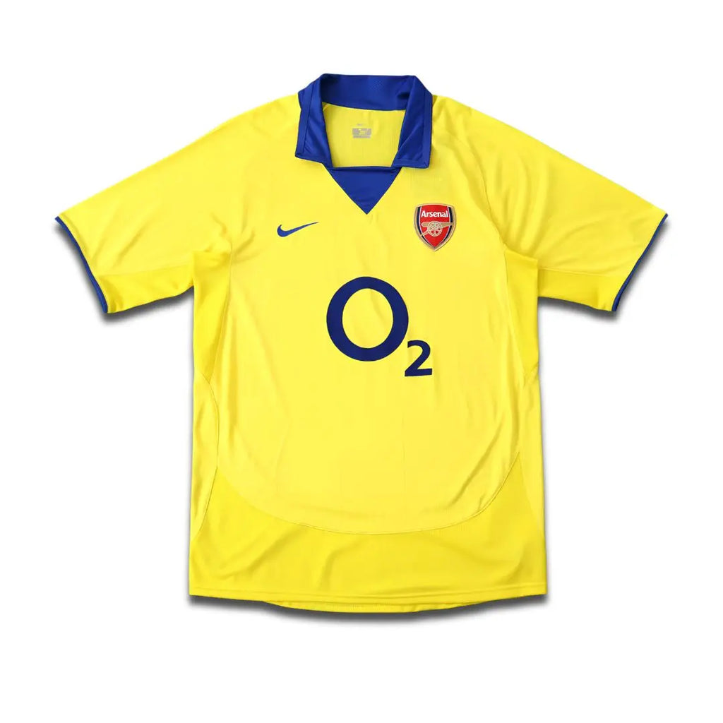 Yellow Arsenal jersey with O2 sponsor and Navy trims.