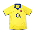 Yellow Arsenal jersey with O2 sponsor and Navy trims.