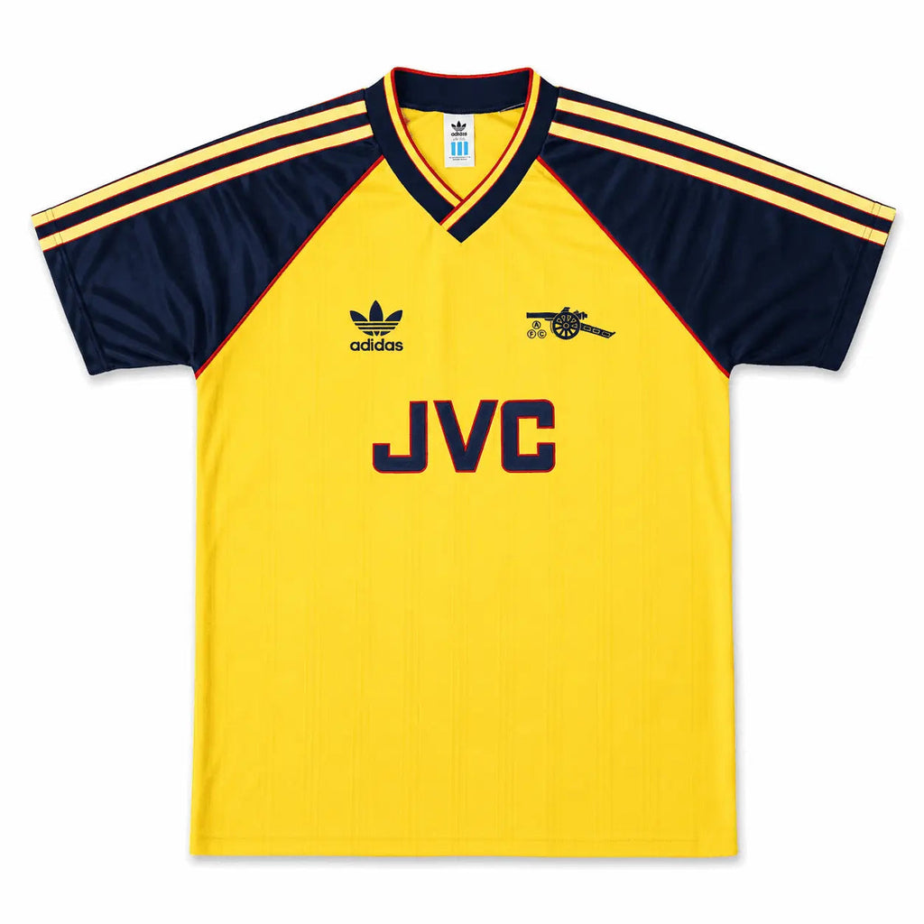 A vintage yellow and navy blue Adidas Arsenal soccer jersey with JVC sponsor branding on the front, displayed flat against a white background.