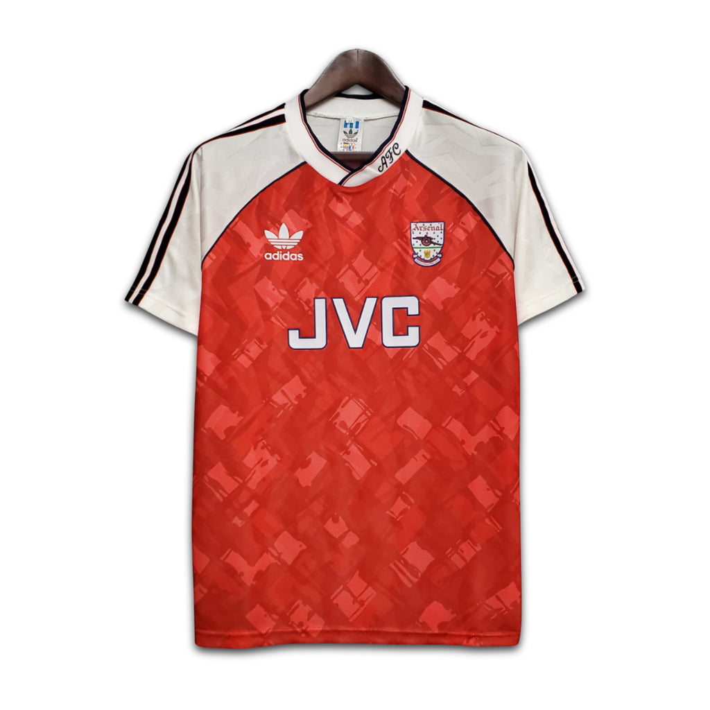 Red and white sports jersey with Adidas logo on a hanger