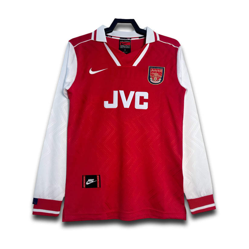 Red and white sports jersey with Nike and JVC logos on a white background