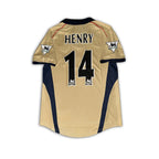 Arsenal 2001 02 SEGA gold away shirt sitting on a white background.