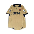Arsenal 2001 02 SEGA gold away shirt sitting on a white background.