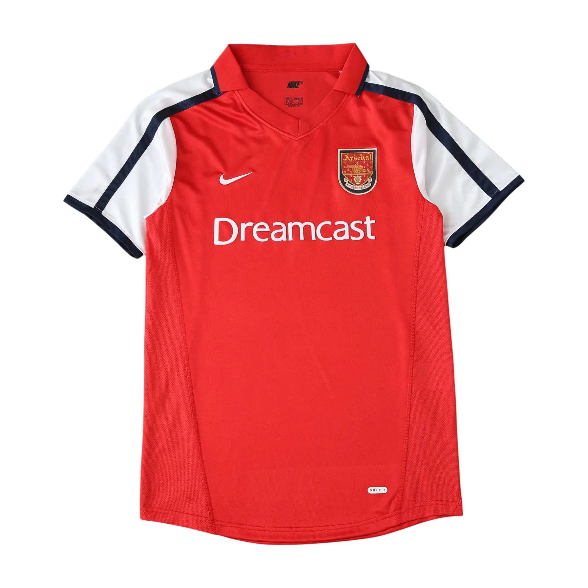 A red Nike Arsenal short-sleeve soccer jersey with white and navy blue sleeve stripes, featuring the 'Dreamcast' sponsor logo on the chest.