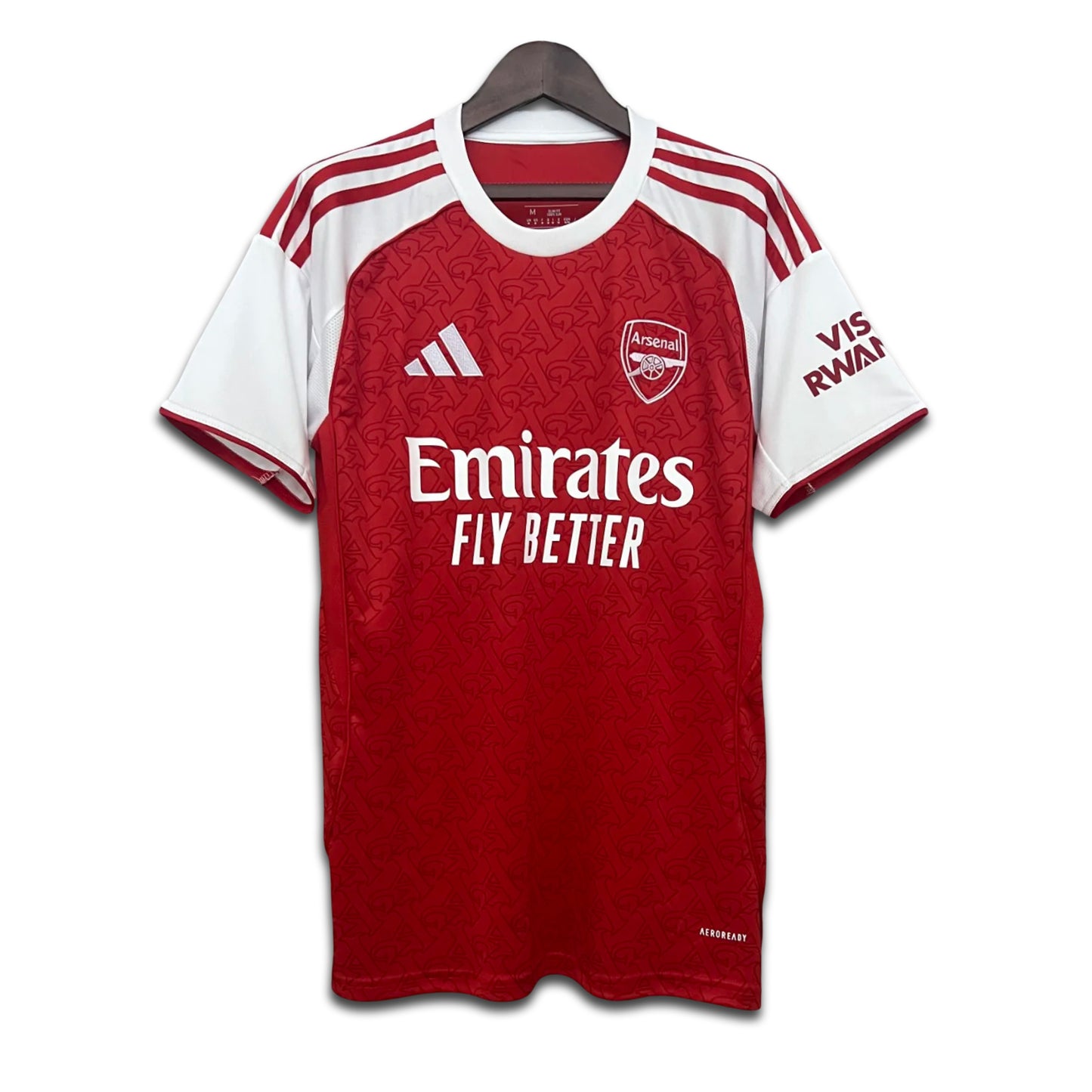 Red and white Arsenal football jersey with Adidas logo on a hanger