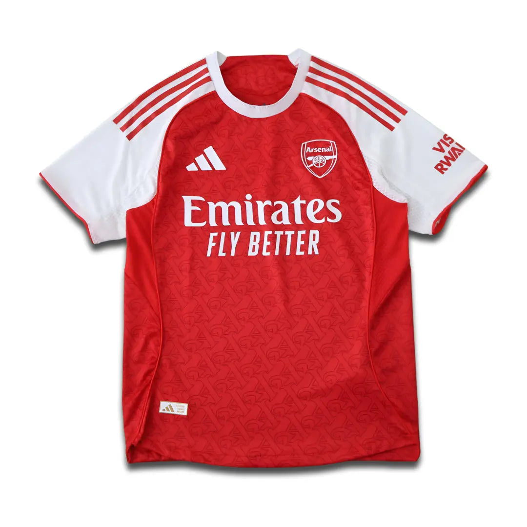 Arsenal Red and White jersey with Emirates Sponsor, sitting on a white background with a subtle drop shadow.