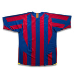 A short-sleeve soccer jersey with vertical red and blue stripes, featuring yellow and orange details on the inner neck and yellow accents at the bottom hem, displayed flat against a white background.