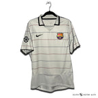 Gray soccer jersey with red and black stripes, featuring the Barcelona club crest and a Nike logo.