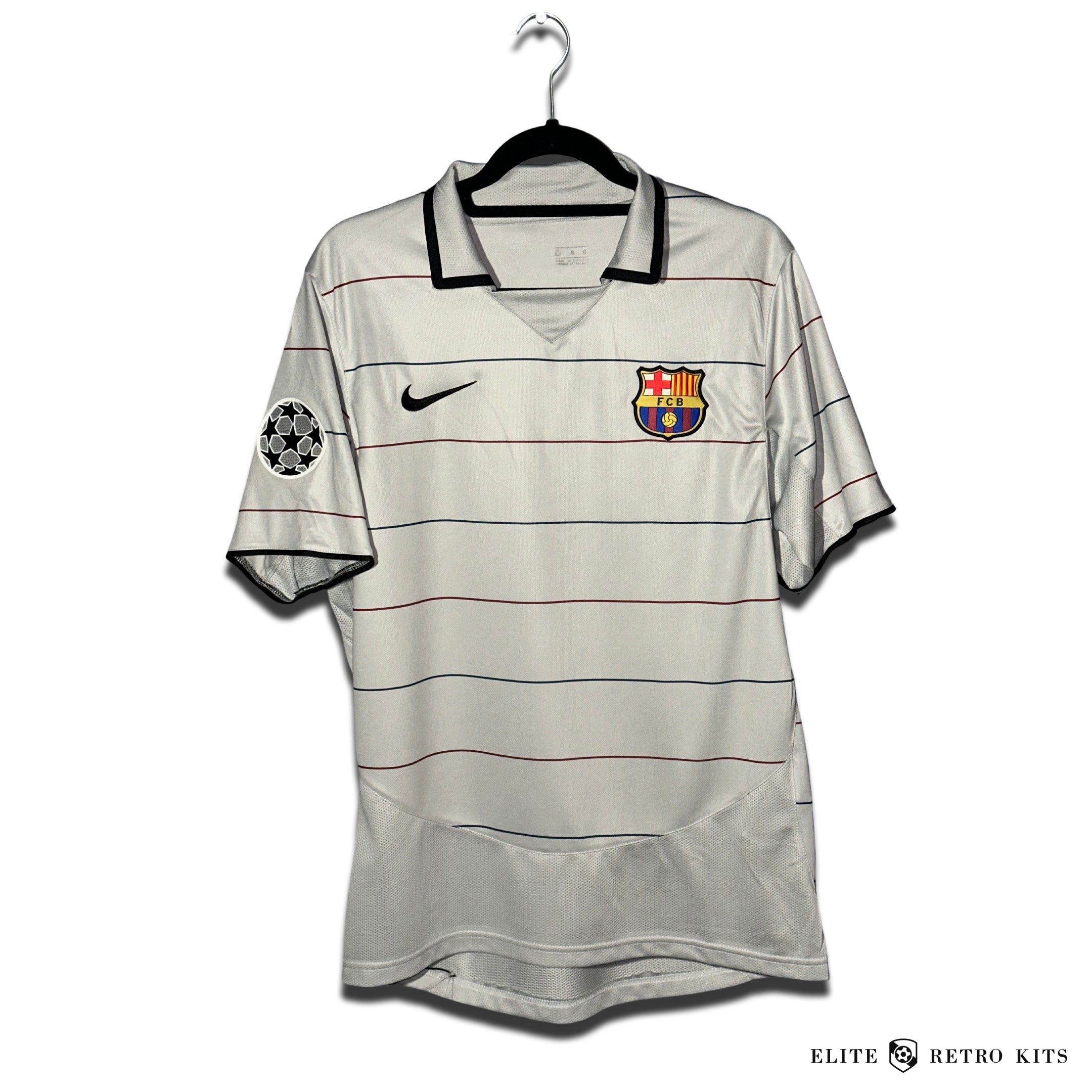 Gray soccer jersey with red and black stripes, featuring the Barcelona club crest and a Nike logo.