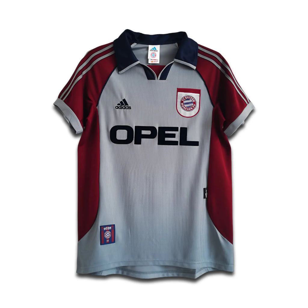 Red and gray sports jersey with Opel and Adidas logos on a hanger
