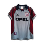 Red and gray sports jersey with Opel and Adidas logos on a hanger