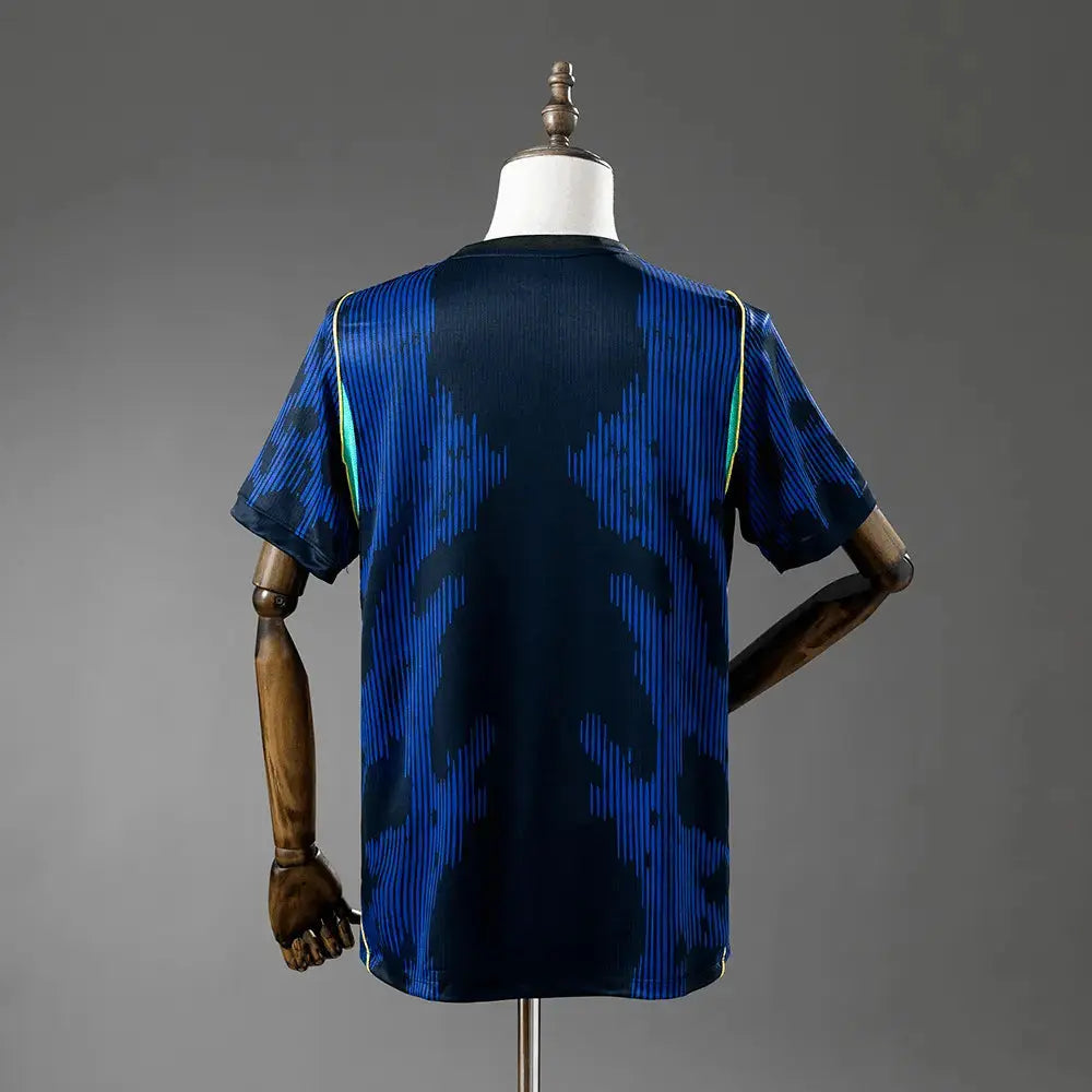 Blue camouflage-patterned shirt on a mannequin against a gray background