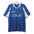 A classic blue Chelsea FC home shirt with white and yellow accents, Umbro branding, and Autoglass sponsor logo.