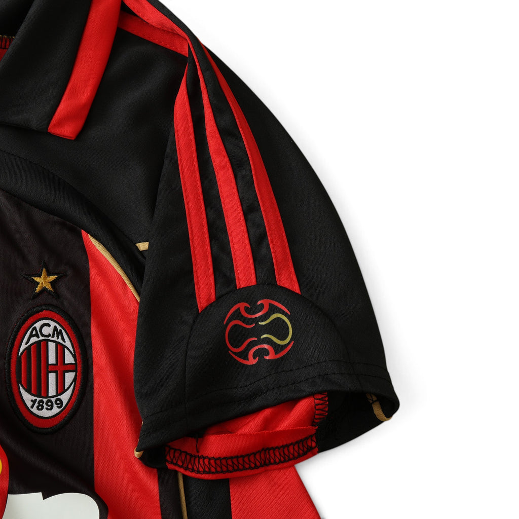Elite Retro Kits AC Milan 2006/07 home kids jersey featuring iconic red and black stripes and embroidered club crest.
