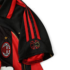 Elite Retro Kits AC Milan 2006/07 home kids jersey featuring iconic red and black stripes and embroidered club crest.
