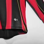 Elite Retro Kits AC Milan 2006/07 long sleeve home shirt featuring red and black stripes and Climacool technology.