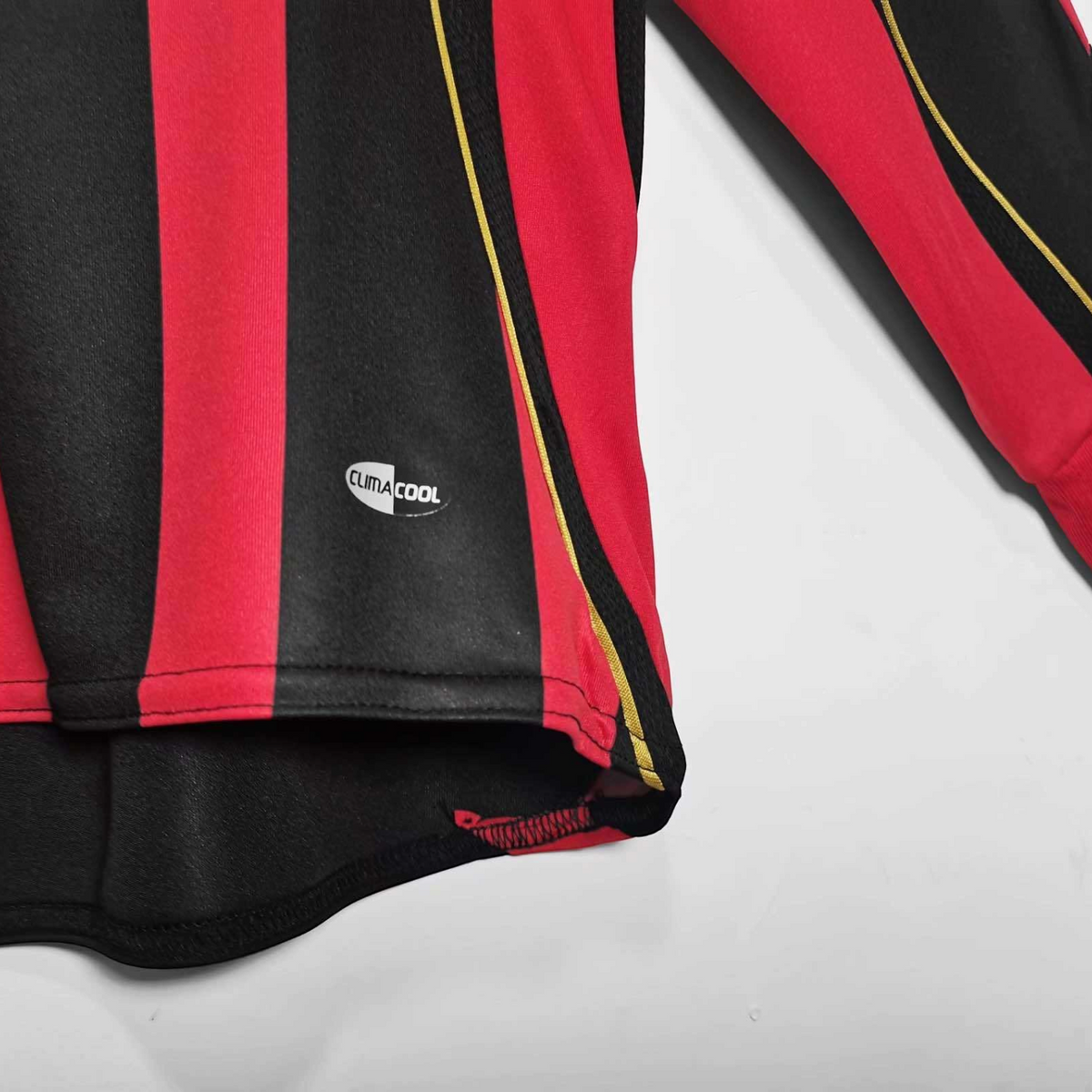 Elite Retro Kits AC Milan 2006/07 long sleeve home shirt featuring red and black stripes and Climacool technology.