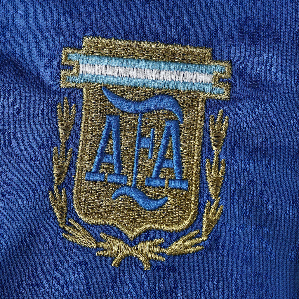 Elite Retro Kits Argentina 1994 away shirt featuring a detailed embroidered AFA crest on deep blue fabric