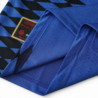 Elite Retro Kits Argentina 1994 away shirt featuring deep blue fabric, black diamond graphics, and AFA crest detail.