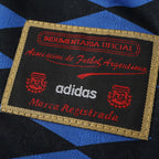 Elite Retro Kits Argentina 1994 away shirt detail showing the official Adidas AFA embroidered patch on blue fabric