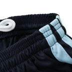 Elite Retro Kits Argentina 2026 kids home kit shorts featuring navy fabric, sky-blue side stripes, and white drawstring