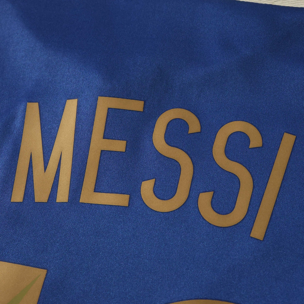 Elite Retro Kits Argentina 2014 away shirt featuring gold Messi lettering on a dark blue fabric background
