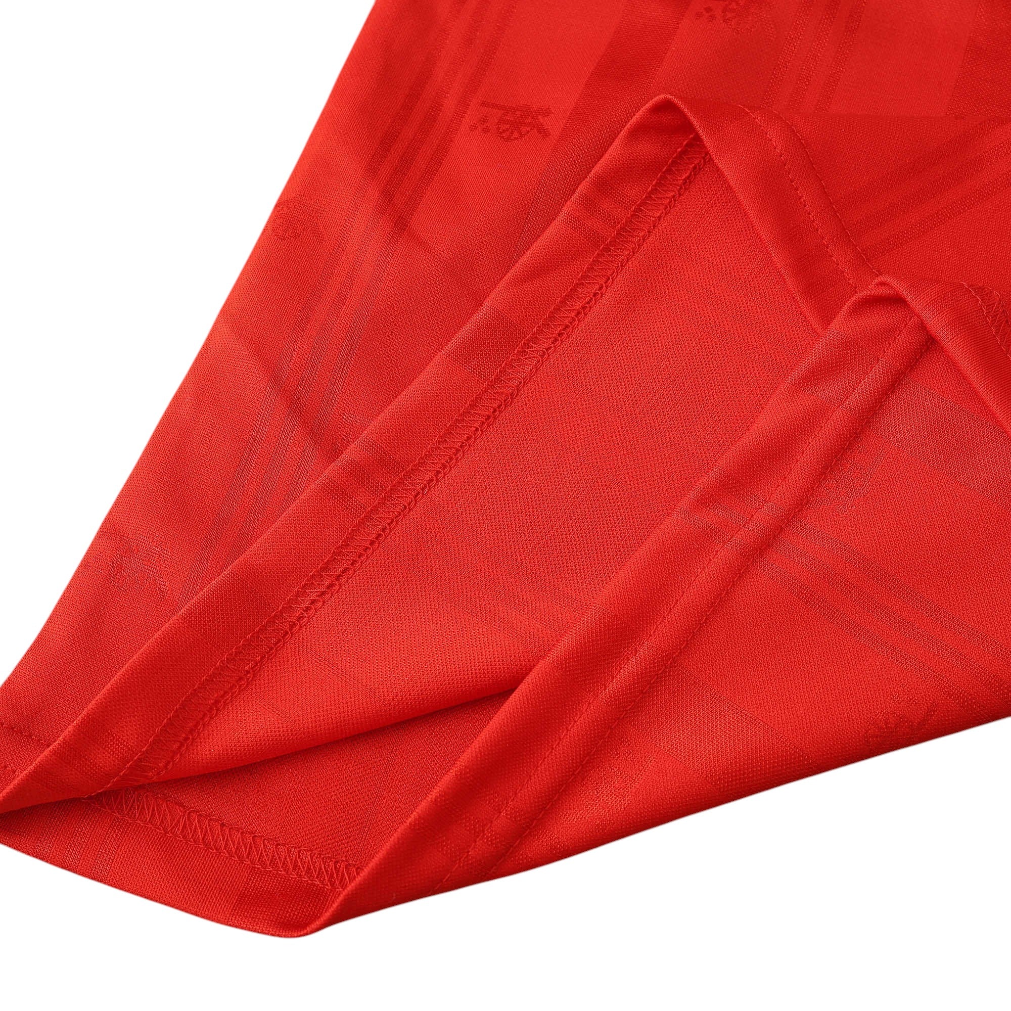 Elite Retro Kits Arsenal 1988/90 home shirt featuring a red fabric with subtle tonal jacquard patterns and hem detail.