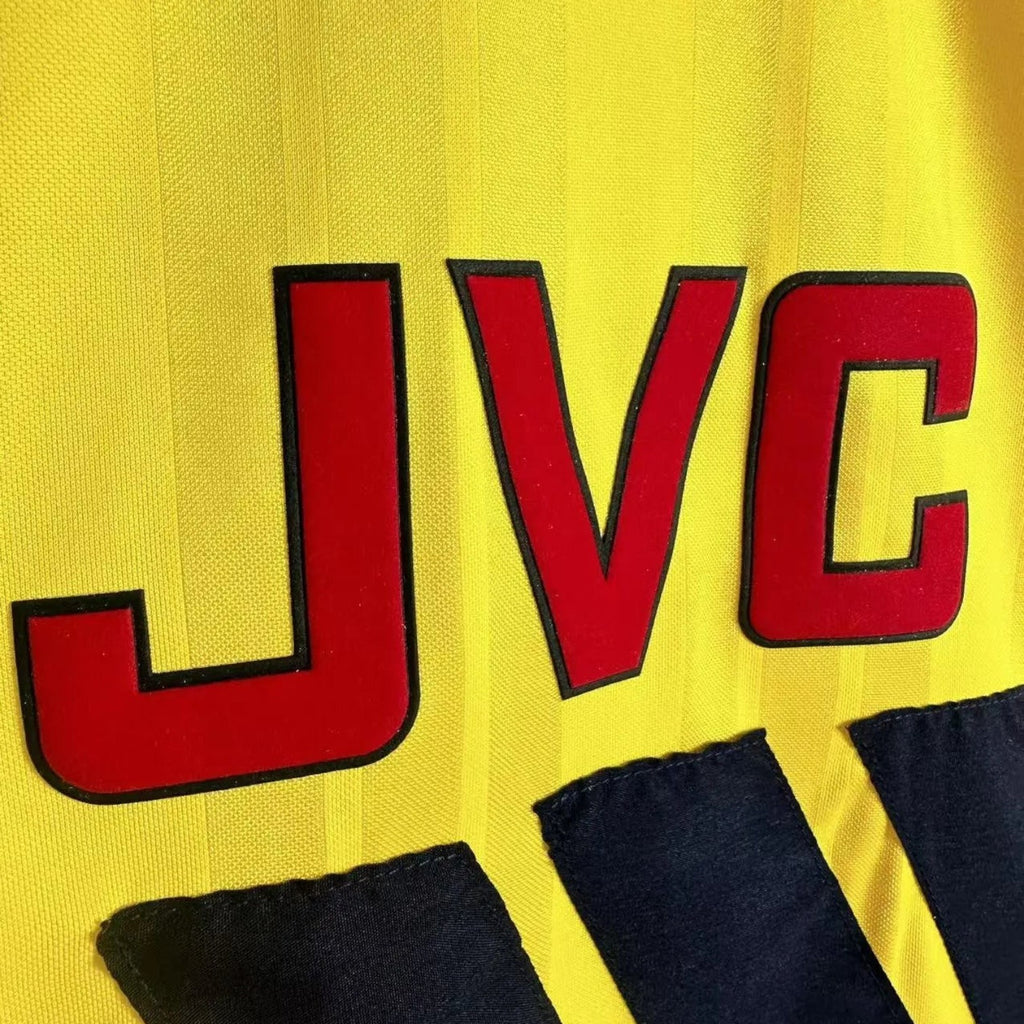 Elite Retro Kits Arsenal 1993/94 away shirt featuring the iconic red JVC sponsor logo on a yellow textured fabric