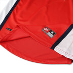 Elite Retro Kits Arsenal 1998/99 home shirt hem detail showing Nike tag and red fabric with white side panels